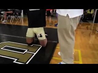 College Wrestler Adjusting Bulge